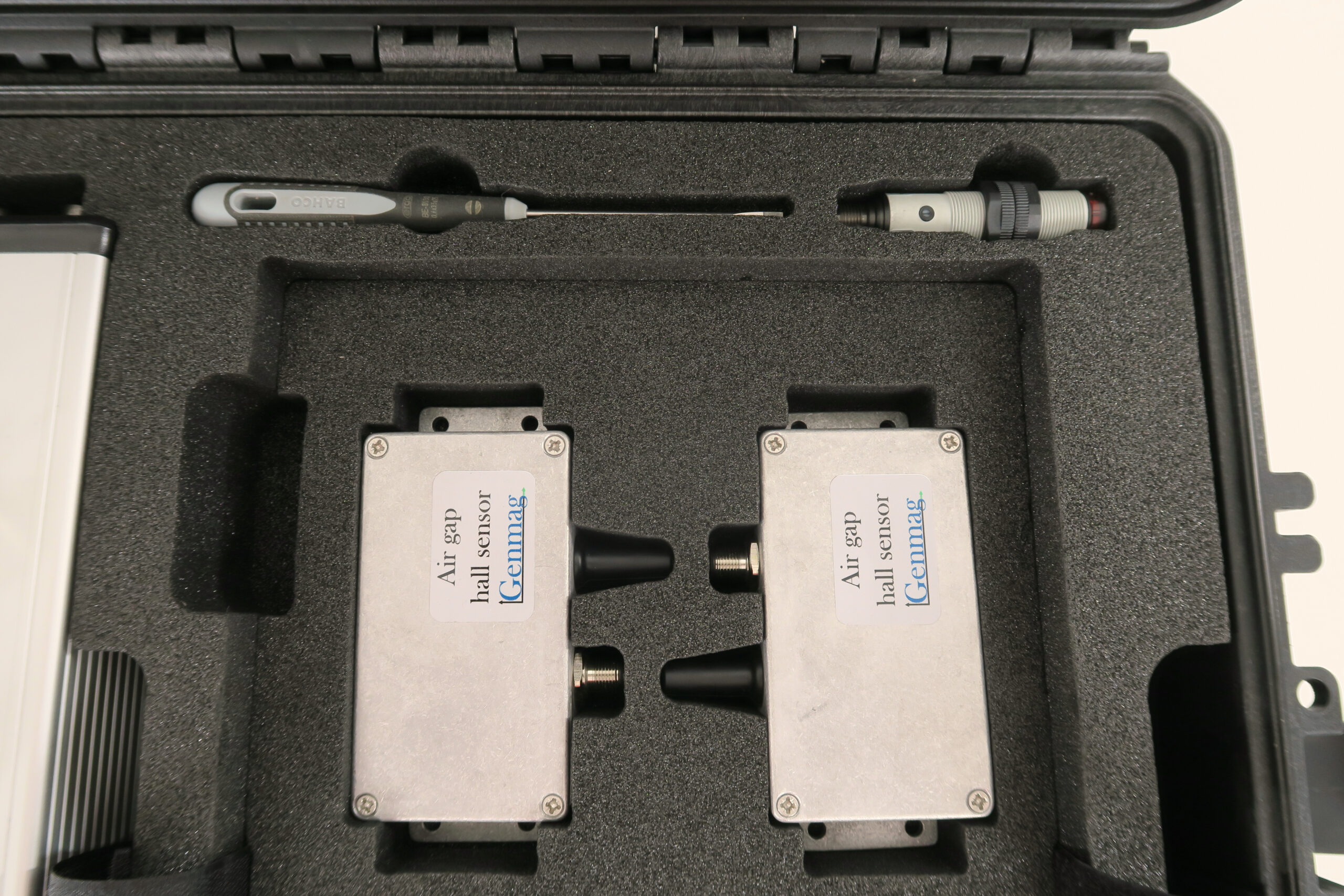 Two junction boxes, an optical sensor and a screwdriver