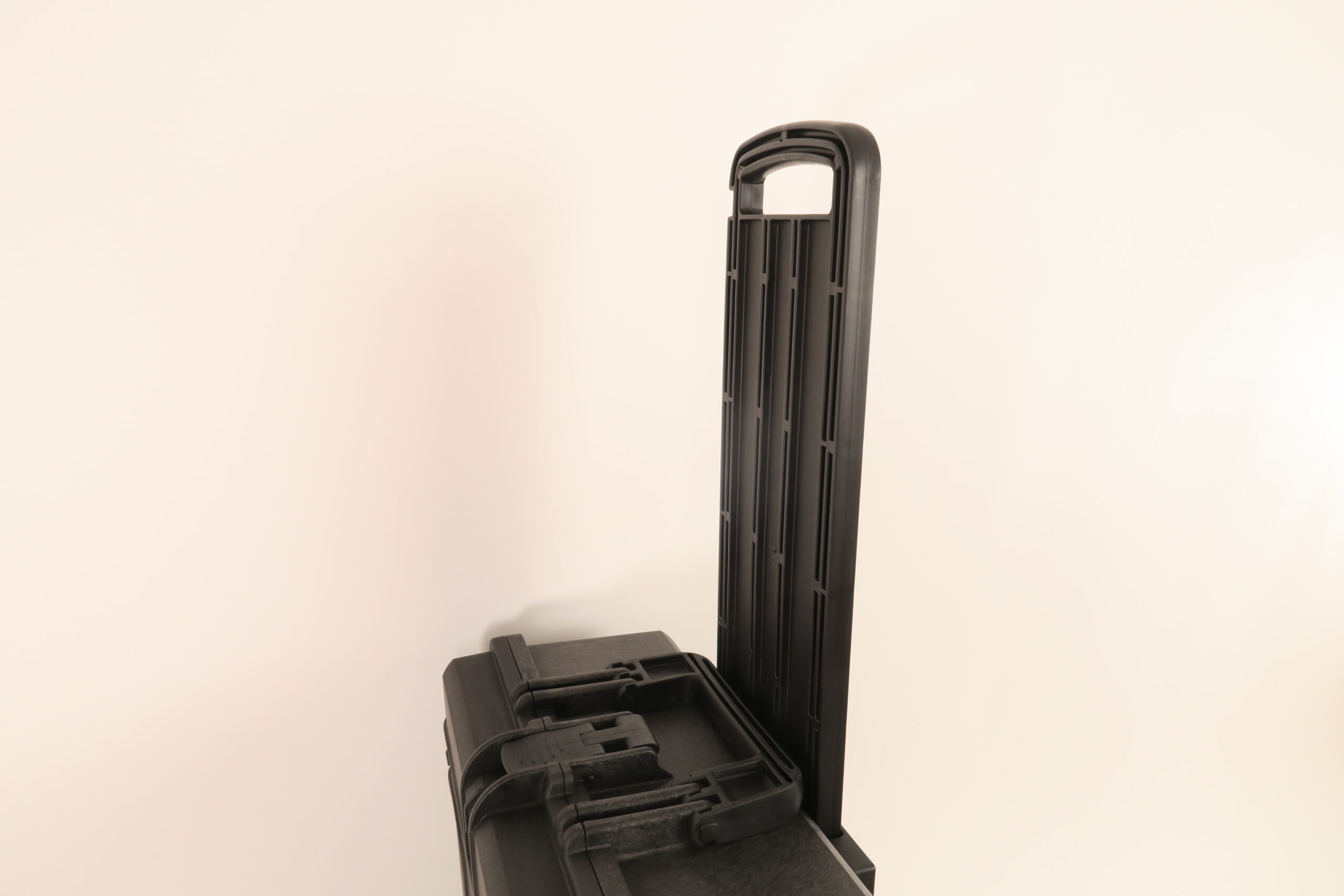Handle of wheeled hardcase.